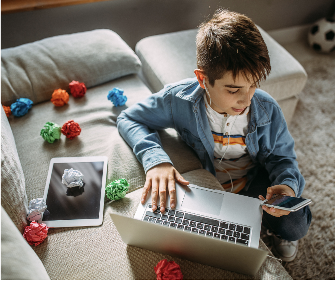 Child on computer accessing social media.